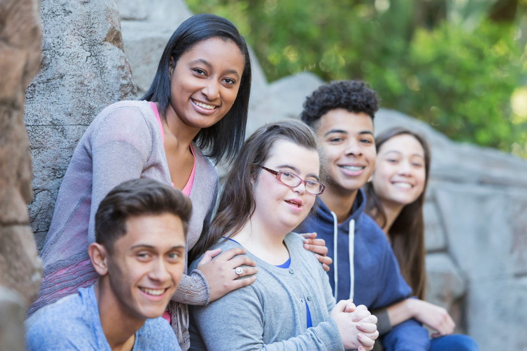 A group of young people appear together.