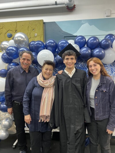 ACA/NY member Peter Hirschfeld at graduation with friends and family.